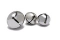 three different size silver bells white background Royalty Free Stock Photo