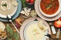 Three different soups on wooden table