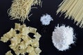 Three different types of pasta are laid out on black background Royalty Free Stock Photo