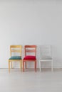 Three different vintage chairs in the interior of a white room Royalty Free Stock Photo