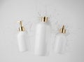 Three different white cosmetic bottles in water splash on gray background 3D render, hair and bory care products Royalty Free Stock Photo