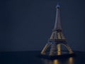Three-Dimensional Image of the Eiffel Tower on a Table with Neon Effects.