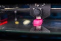 Three dimensional printing machine prints physical 3D model Royalty Free Stock Photo