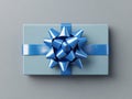 Three-dimensional rendering of a white blank gift card with a blue ribbon bow isolated on a gray background with shadows Royalty Free Stock Photo