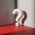 Three dimensional white question marks casting shadows against a textured wall and a red surface Royalty Free Stock Photo