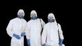 Three disinfectors walk in holding the disinfectant in their hands, Alpha Channel