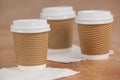 Three disposable coffee cup with tissue paper