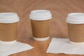 Three disposable coffee cup with tissue paper