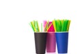 Three disposable cups with multi colored plastic straws. Ban single use plastic Royalty Free Stock Photo