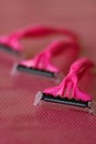 Three disposable pink shaving razors Royalty Free Stock Photo