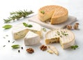 Various types of artisanal cheese displayed on a marble surface with herbs and nuts during a gourmet tasting event Royalty Free Stock Photo