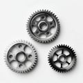 Three Distinct Metallic Gears Showcasing Intricate Designs and Functional Mechanisms in a Minimalist Setting Royalty Free Stock Photo