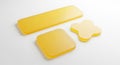 Three yellow sticky notes of different shapes arranged on a clean surface for organization and reminders Royalty Free Stock Photo