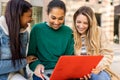 Three multicultural female university students studying together at campus Royalty Free Stock Photo