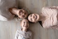 Three diverse women daughter mother grandma laughing posing on floor