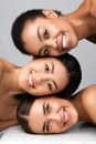 Three Diverse Women Posing Together Smiling On Gray Background, Vertical