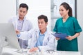 Three doctors discussing patient files on office Royalty Free Stock Photo