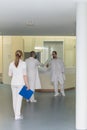 three doctors in a hospital corridor Royalty Free Stock Photo