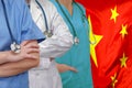 Three Doctors with stethoscope on China flag Royalty Free Stock Photo