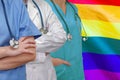 Three Doctors with stethoscope on LGBT flag Royalty Free Stock Photo