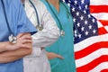 Three Doctors with stethoscope on US flag Royalty Free Stock Photo