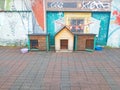three dog kennels are on the sidewalk Royalty Free Stock Photo