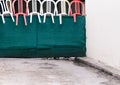 Three dogs guarding house looking and barking from under gates