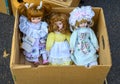 Three dolls in a box abandoned Royalty Free Stock Photo