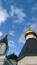 Three domes with golden crosses of the Russian Orthodox Church under blue sky with clouds Royalty Free Stock Photo