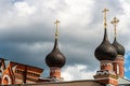 Russia, Yaroslavl, July 2020. Magnificent domes of a brick Orthodox church against a stormy sky. Royalty Free Stock Photo