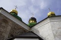 Three domes with three golden orthodox crosses on the roof of the temple Royalty Free Stock Photo