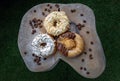 Three doughnuts covered with Cookies and creme, Almendras and Choco peanut butter Royalty Free Stock Photo