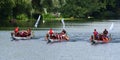 Three Dragon Boats Racing on the river Ouse at St Neots. Royalty Free Stock Photo