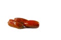 Three dried date fruit on isolated white background Royalty Free Stock Photo