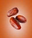 Three dried dates close up in the air Royalty Free Stock Photo