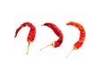 Three dried hot red chili peppers isolated on white. burning and spicy vegetable used in cooking to prepare a variety of spices an