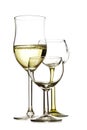 Three drinking glasses, one is filled with white wine, the other Royalty Free Stock Photo