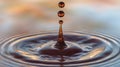 Three Drops of Amber Liquid Forming Rings on Water Royalty Free Stock Photo