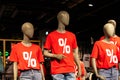 three dummy mannequin models wearing red shirts with white text percent sign.sale of fashion shop.sale, shopping concept
