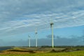 Three Dutch windmills in a row for creating windenergy Royalty Free Stock Photo