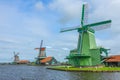 Three Dutch Windmills at the Waters Edge Royalty Free Stock Photo