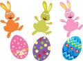 Three Easter bunnies and Easter eggs