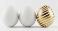 Three Easter Eggs on a White Background One Decorated with Gold Stripes holiday celebration Royalty Free Stock Photo