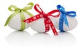 Three Easter eggs with festive bow isolated Royalty Free Stock Photo