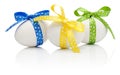 Three Easter eggs with festive bow isolated