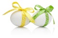 Three Easter eggs with festive bow isolated Royalty Free Stock Photo