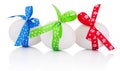 Three Easter eggs with festive bow isolated on a white background Royalty Free Stock Photo