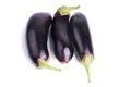 Three eggplant water drops on white background close up isolated top view Royalty Free Stock Photo