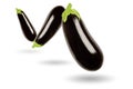 Three eggplants in a row floating in the air, on white background Royalty Free Stock Photo