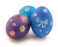 Three eggs (blue, turquoise, violet) with ornament